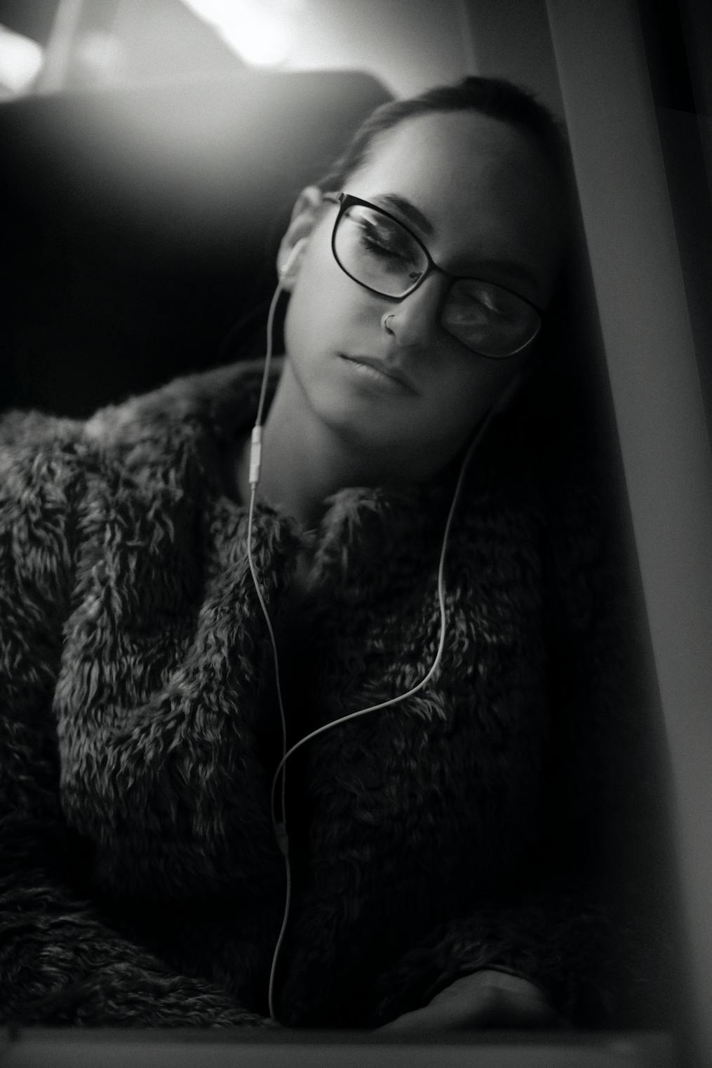 Audiobooks-and-dictation-woman-sleeping-with-headphones-on-a-train-new-blog-post-how-to-balance-teaching-and-writing-susan-shiney